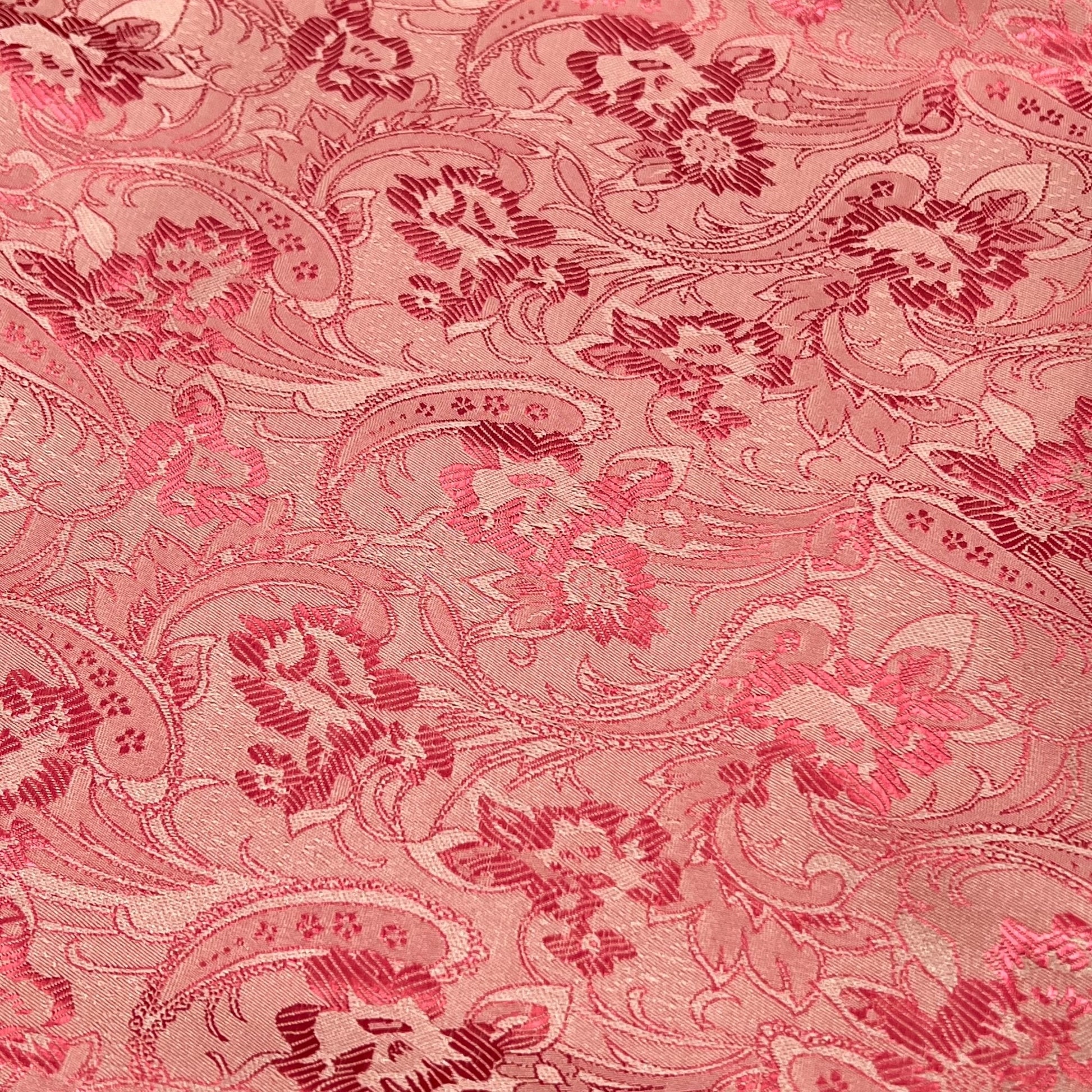 Elegant pink floral paisley pattern fabric, showcasing luxurious craftsmanship and intricate design details.