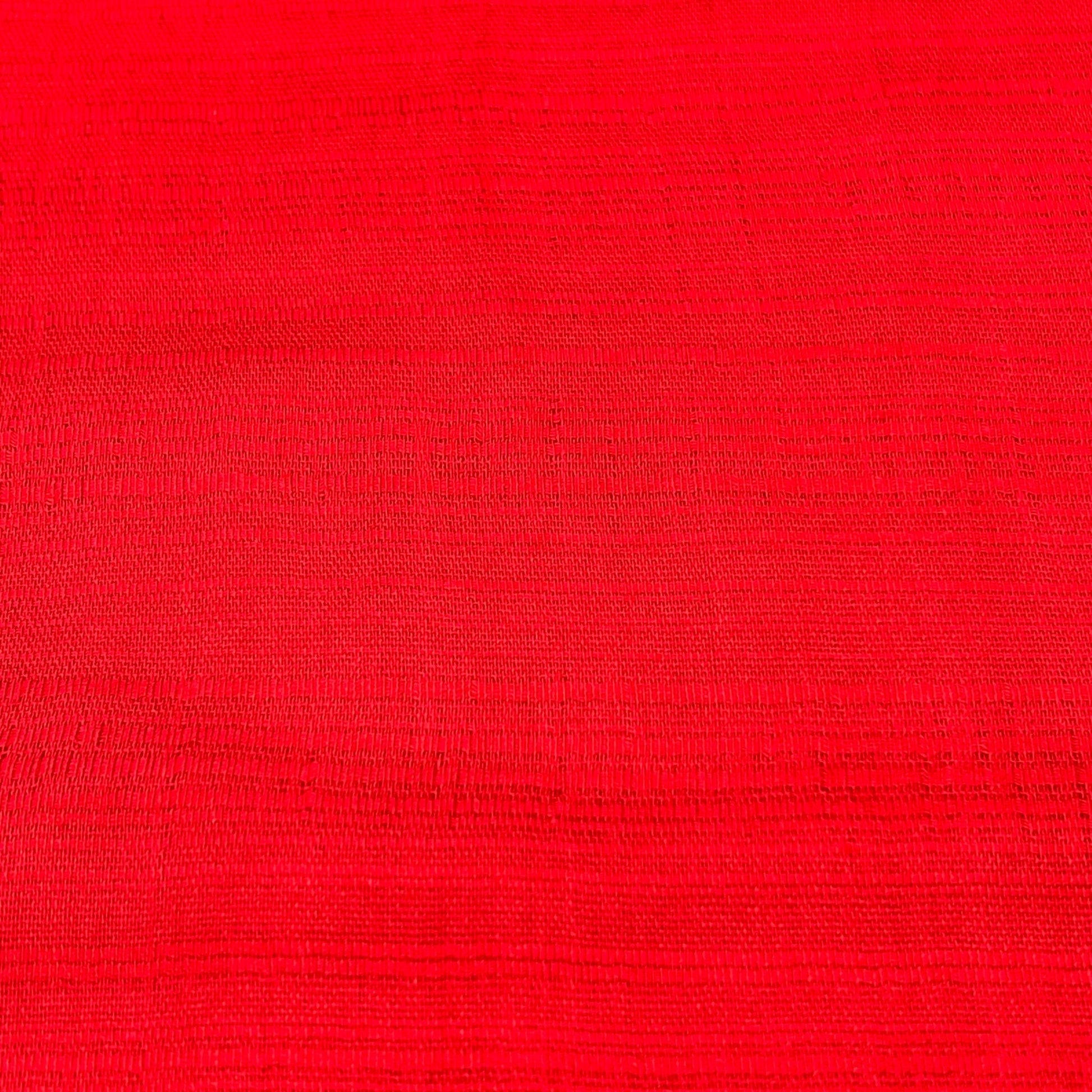 Solid red Thai silk scarf fabric, showcasing its rich texture and vibrant color for elegant accessorizing.